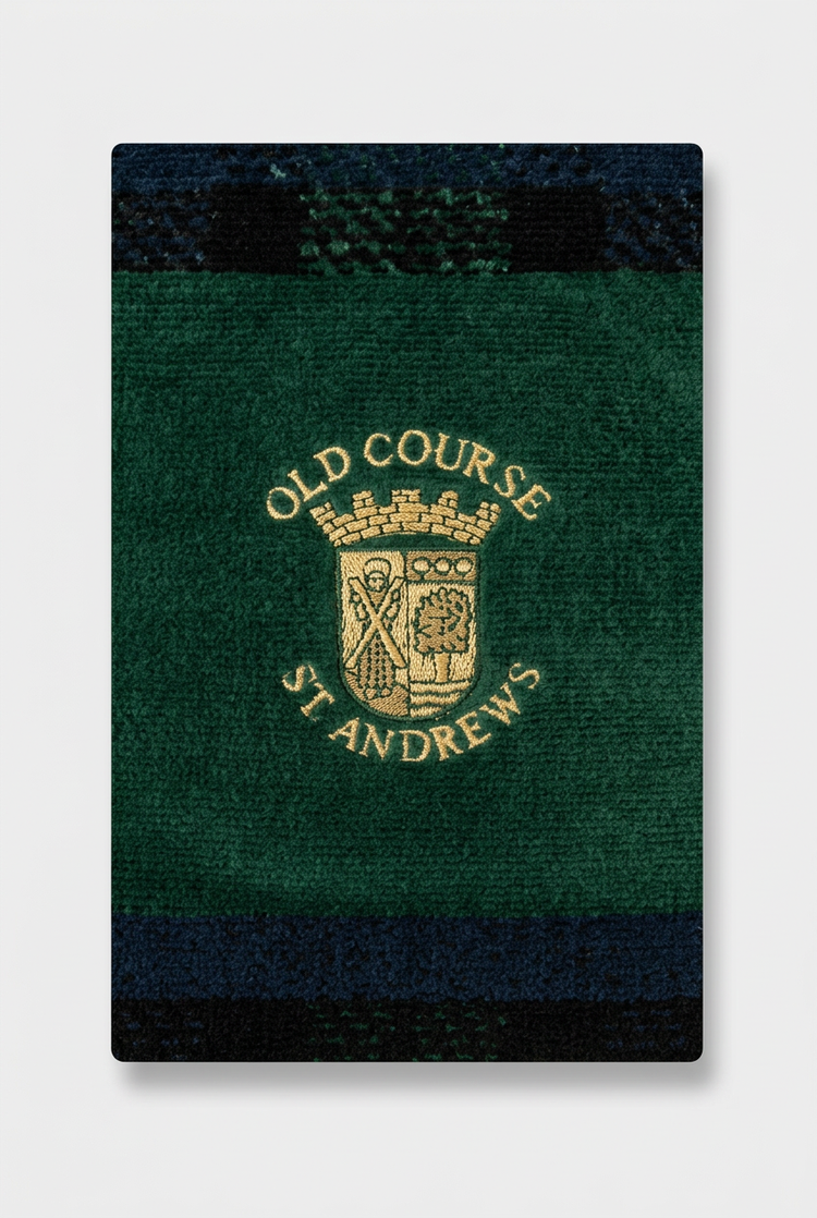 Close-up of the crest on the green tartan velour towel