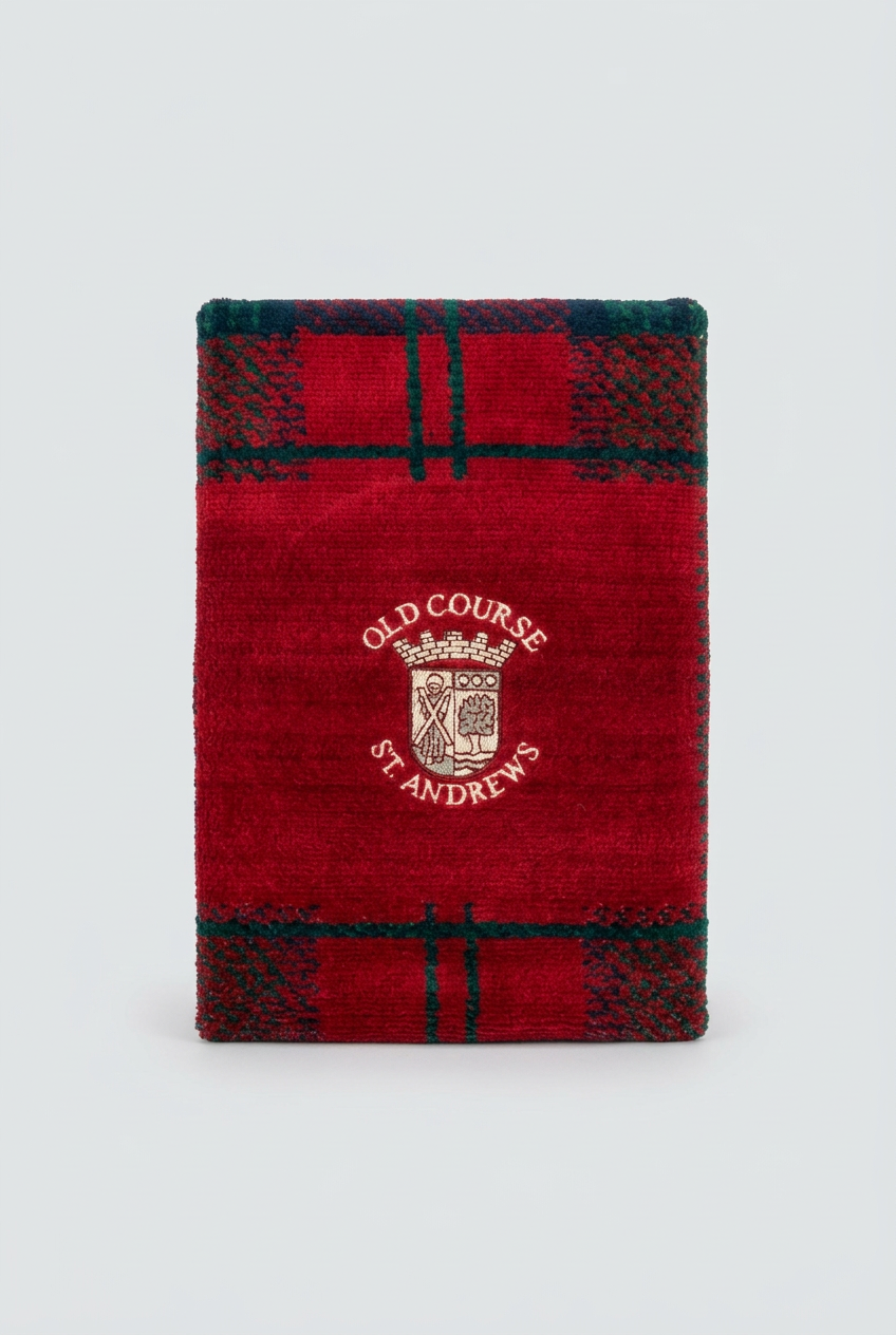 Close-up of the crest on the red tartan velour towel
